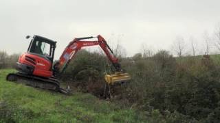 Mulching head on Kubota miniexcavator [upl. by Eimarrej]